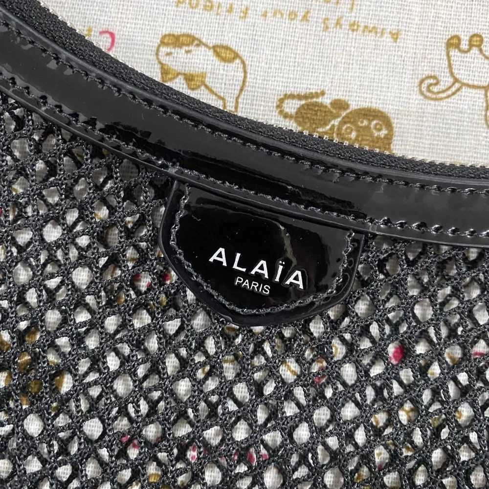 Alaïa Black Woven Crescent Shoulder Bag